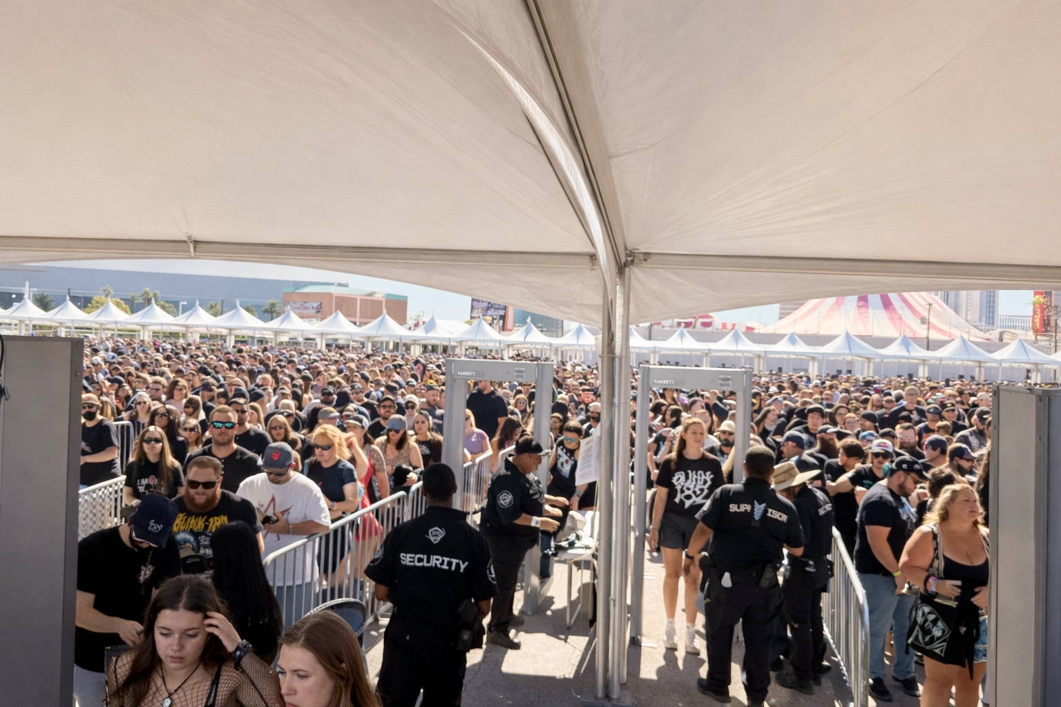 Garrett metal detector screening operation at large outdoor event