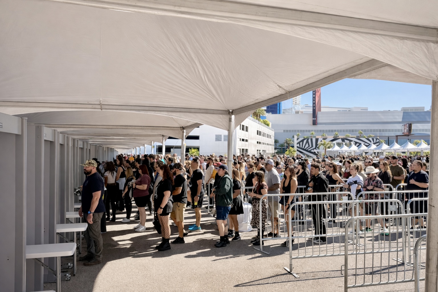 High-volume crowd screening with metal detectors at outdoor venue